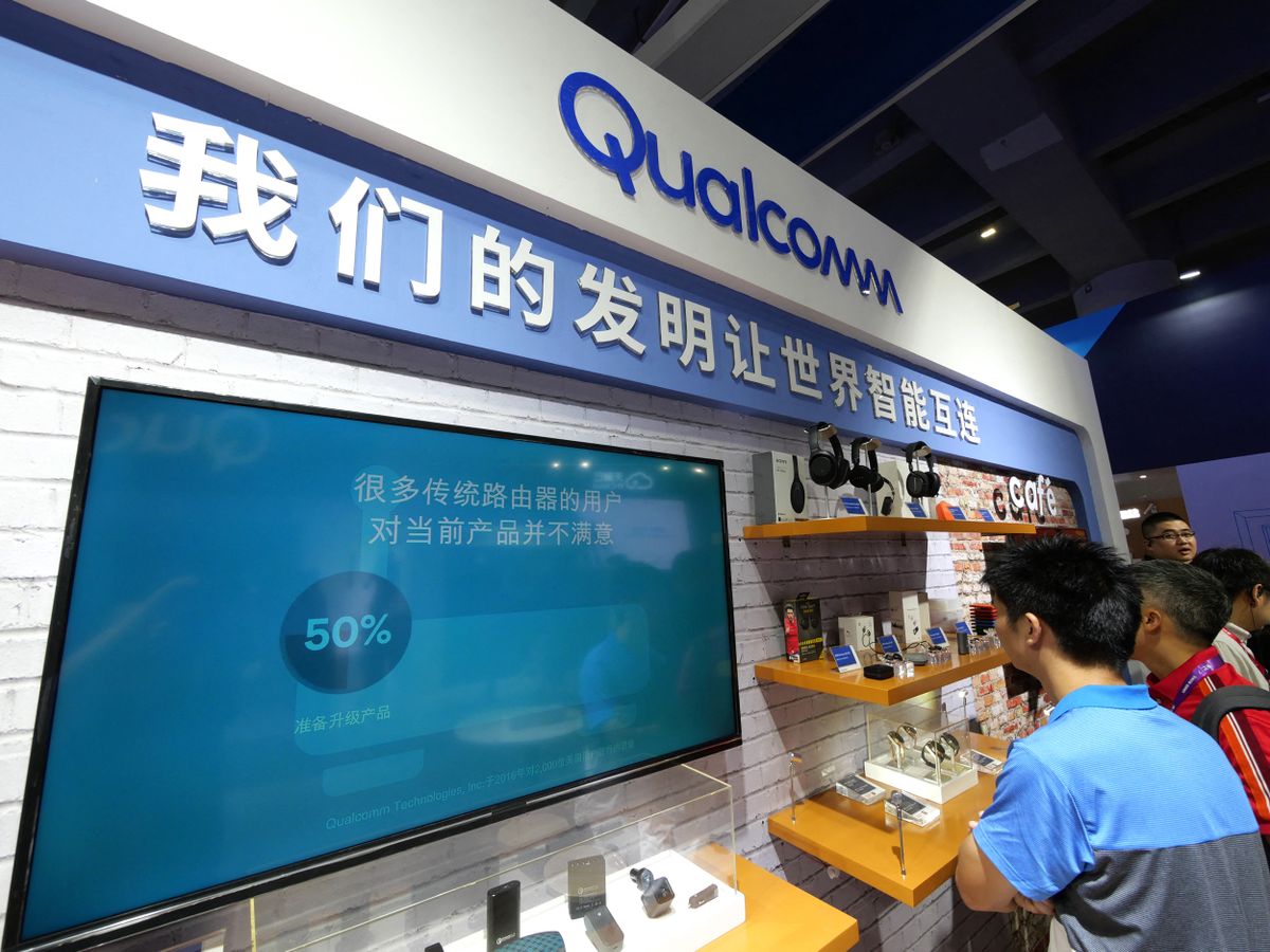 Qualcomm stock soars, but more China tariffs could spoil the party, People visit the stand of Qualcomm during an expo in Guangzhou city, south China's Guangdong province, 13 September 2018.Qualcomm's remarkable run could run into trouble as tariffs on China impact its key business areas. The semiconductor industry at large has been under pressure on the trade war this year as fear that the largest market for semiconductors, China, could be diminished for U.S. based chip-maker. (Photo by Li zhihao / Imaginechina / Imaginechina via AFP)