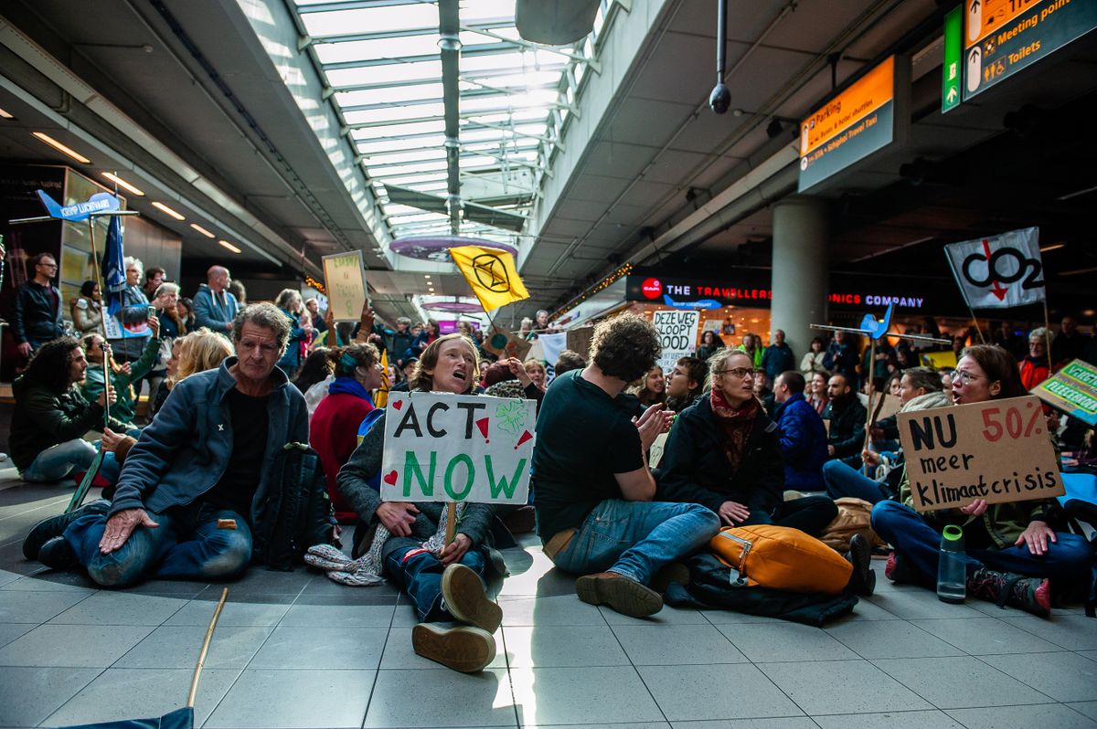 Hundreds of climate activists occupied the main hall for a few hours, while other activists outside blocked private jets. During a disrupted mass action organized by Greenpeace Netherlands and Extinction Rebellion, to demand a climate plan for the airport. In Amsterdam, on November 5th, 2022. 