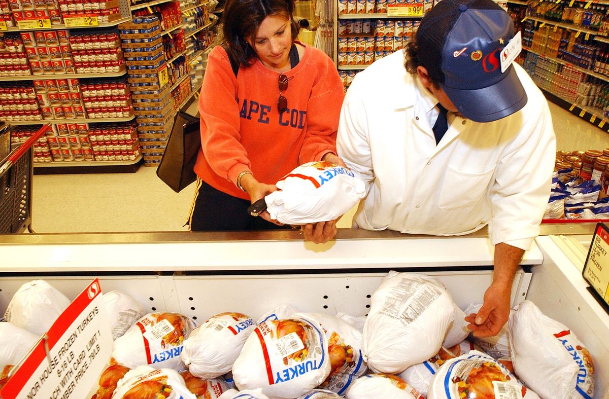 DENVER,CO--HOLIDAY--Safeway market manager, meat dept., 6th Ave. and Corona, Lyn Makowsky, right, helps Pam Graul, Denver, find the right size turkey for the thanksgiving holiday. THE DENVER POST/ ANDY CROSS DENVER,CO--HOLIDAY--Safeway market manager, meat dept., 6th Ave. and Corona, Lyn Makowsky, right, helps Pam Graul, Denver, find the right size turkey for the thanksgiving holiday. THE DENVER POST/ ANDY CROSS  (Photo By Andy Cross/The Denver Post via Getty Images)