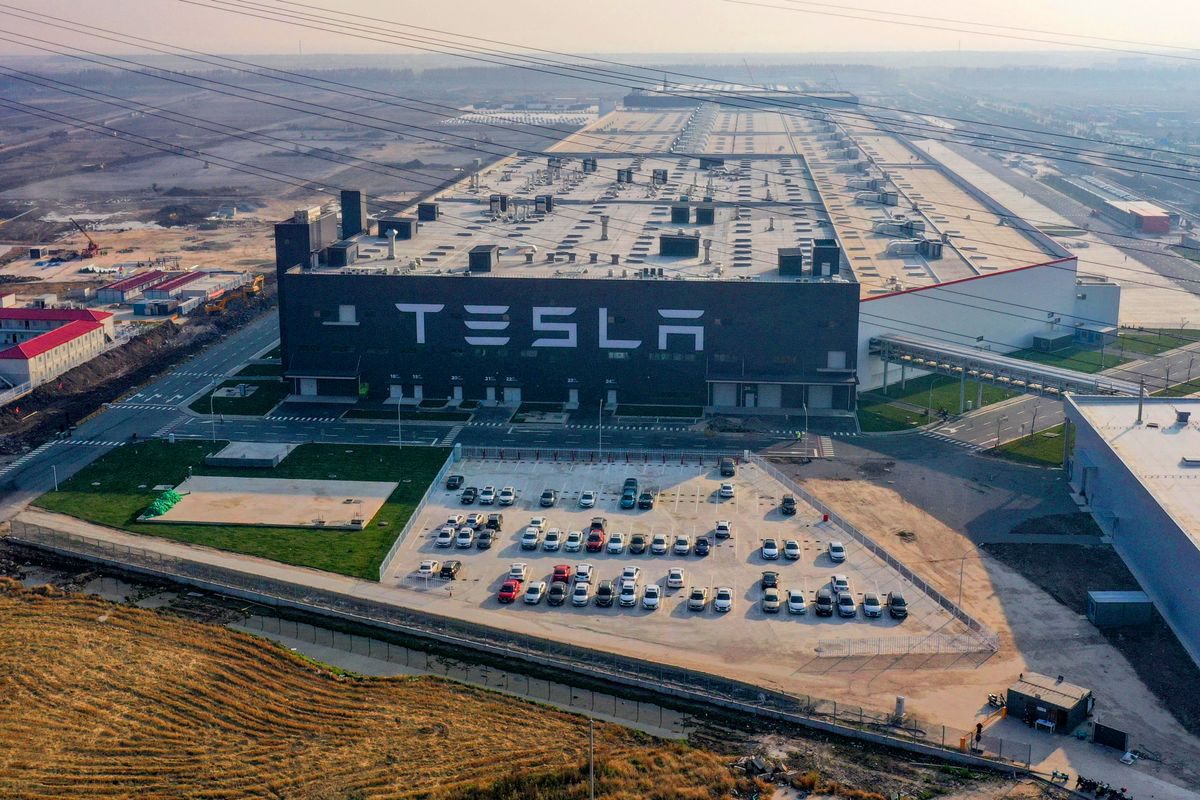 Made-in-China Tesla Model 3 delivered from Shanghai Gigafactory 3 An aerial view of over 200 Tesla Model 3 arrayed in Tesla Gigafactory 3 while more vehicles of the kind coming out of the factory, implying that mass production of made-in-China Tesla vehicles are about to come into the market, Shanghai, China, 8 December 2019. (Photo by Wu Ming / Imaginechina / Imaginechina via AFP)