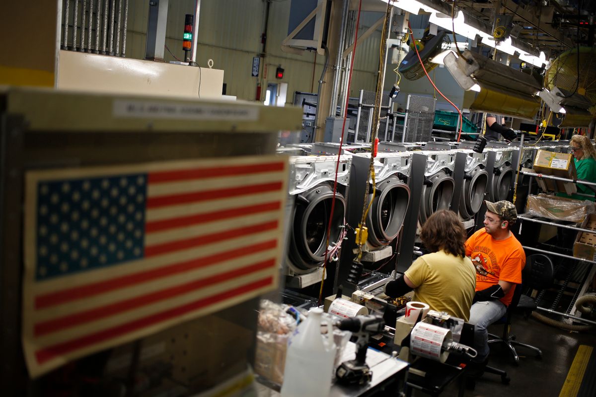 Workers assemble washing machines at the Whirlpool Corp. manufacturing facility in Clyde, Ohio, U.S., on Wednesday, Dec. 9, 2015. The U.S. Census Bureau is scheduled to release business inventories figures on December 11.