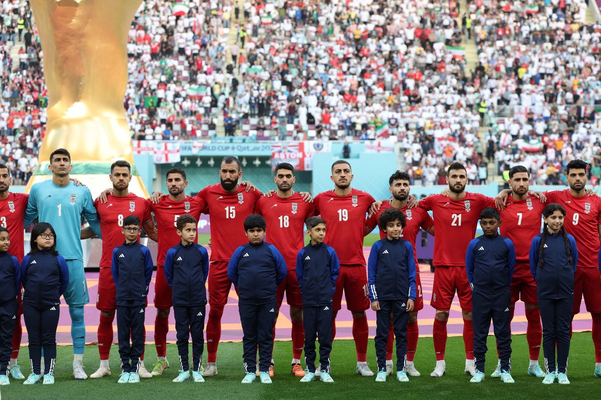 Iran players listen to the national anthem ahead of the Qatar 2022 World Cup Group B football match between England and Iran at the Khalifa International Stadium in Doha on November 21, 2022. 