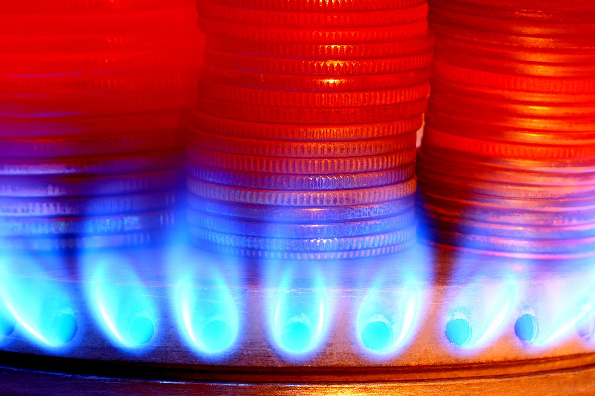Payment for gas. Money and gas torch, The heated coins on fire of a gas flame of a stove burner, gázár, 
