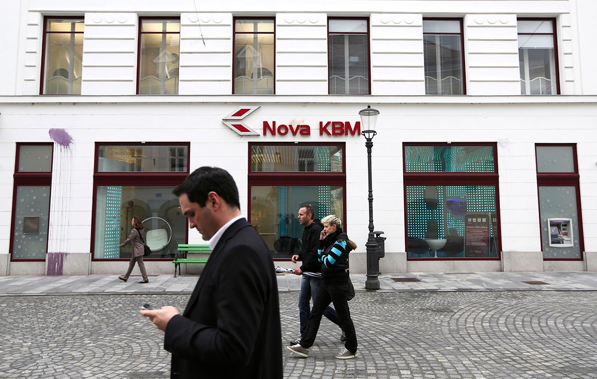 The Slovenian Stock Exchange And Bank Nova Ljubljanska Banka d.d As Slovenia Struggles With Recession,
Pedestrians pass a Nova Kreditna Banka Maribor d.d. (KBM) bank branch in Ljubljana, Slovenia, on Monday, May 6, 2013. Slovenia plans to increase taxes to make up for the swelling budget shortfall as the country works to recapitalize its banks. Photographer: Chris Ratcliffe/Bloomberg via Getty Images