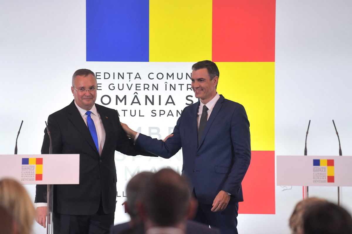 Spanish Prime Minister Pedro Sanchez (R) and Romania's Prime Minister Nicolae Ciuca salute at the end of a press conference after the signing of Foreign Ministries agreements during a Romania-Spain summit in Castellon de la Plana, eastern Spain on Noviembre 23, 2022. 