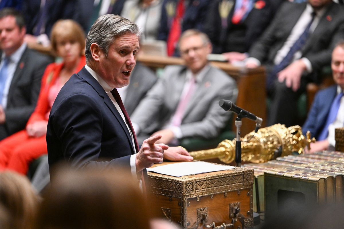 A handout photograph released by the UK Parliament shows Britain's main opposition Labour Party leader Keir Starmer (L) speaking during Prime Minister's Questions (PMQs) in the House of Commons in London on Novermber 2, 2022.