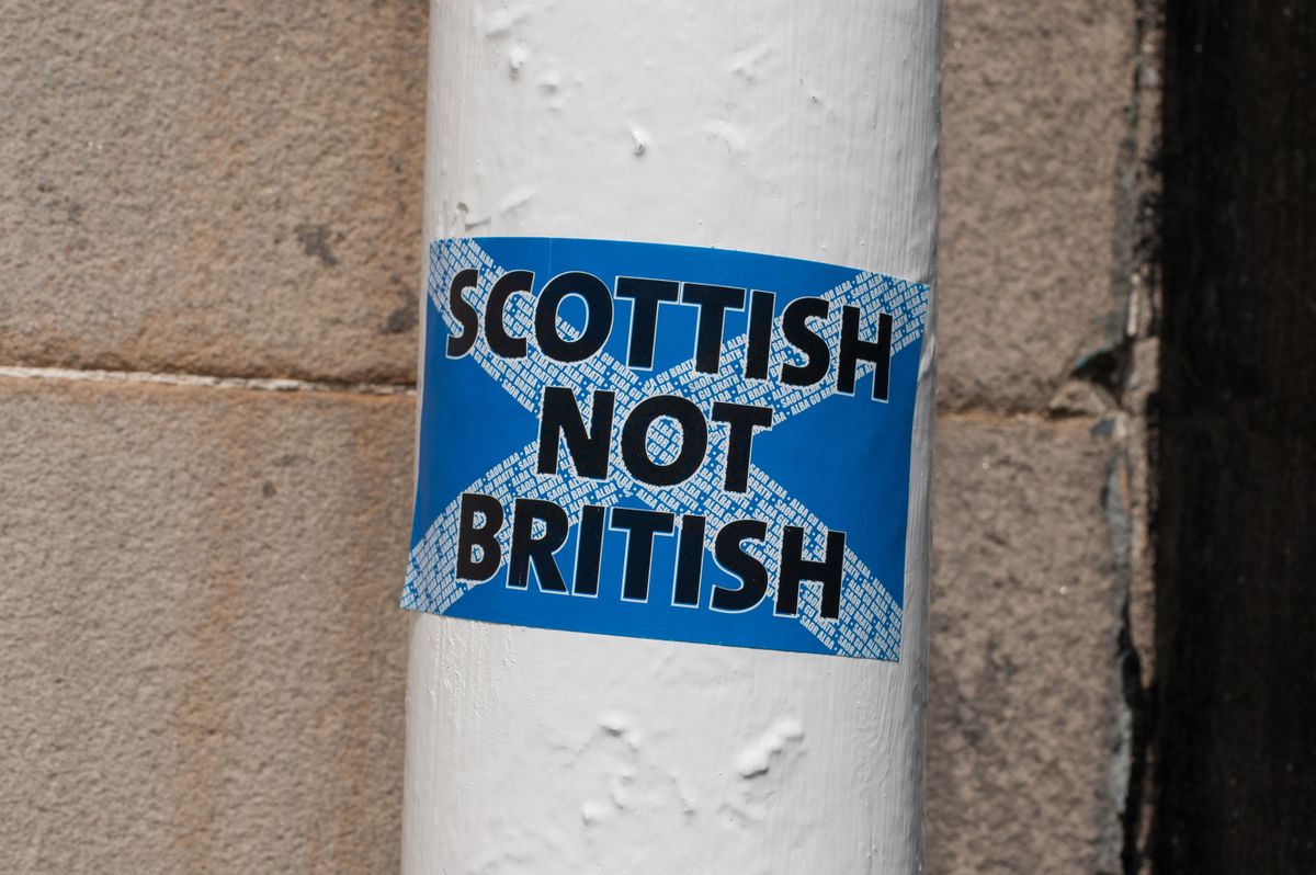 GLASGOW, UK, July 2014: Scottish independence: "Scottish not British" sticker on a white pole in a Scottish street in Edinburgh