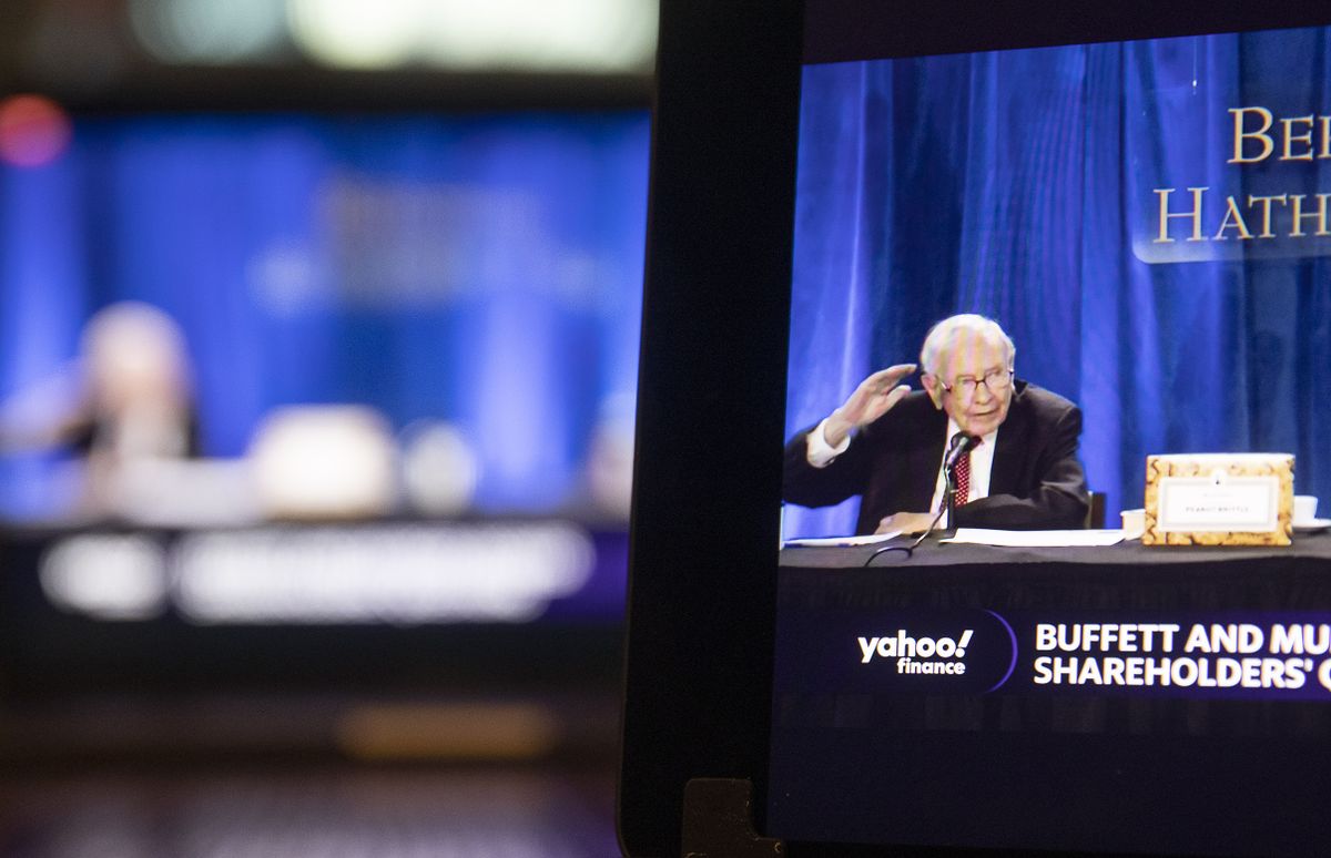 Warren Buffett, chairman and chief executive officer of Berkshire Hathaway Inc., speaks during the virtual Berkshire Hathaway annual shareholders meeting on a laptop computer in Tiskilwa, Illinois, U.S., on Saturday, May 1, 2021. Berkshire's executives addresses shareholders via video-conference to conform with health guidelines, scrapping for a second year an arena event in Omaha, Nebraska, that typically attracted thousands of adoring fans.