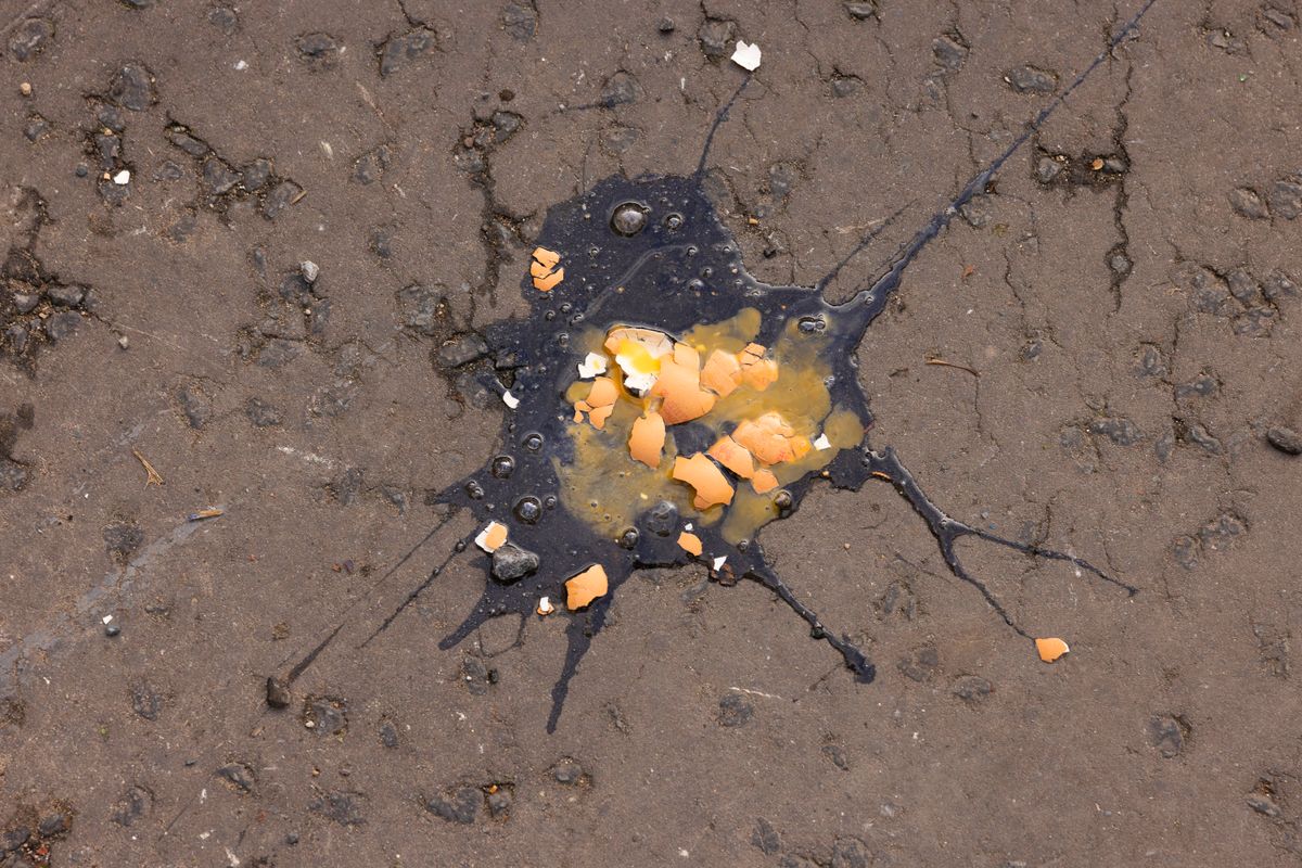 An egg that was thrown in the direction of Britain's King Charles III during a ceremony at Micklegate Bar, is pictured on the road, during his visit to York, northern England on November 9, 2022 as part of a two-day tour of Yorkshire. - Micklegate Bar is considered to be the most important of York's gateways and has acted as the focus for various important events. It is the place The Sovereign traditionally arrives when entering the city. (Photo by James Glossop / POOL / AFP)