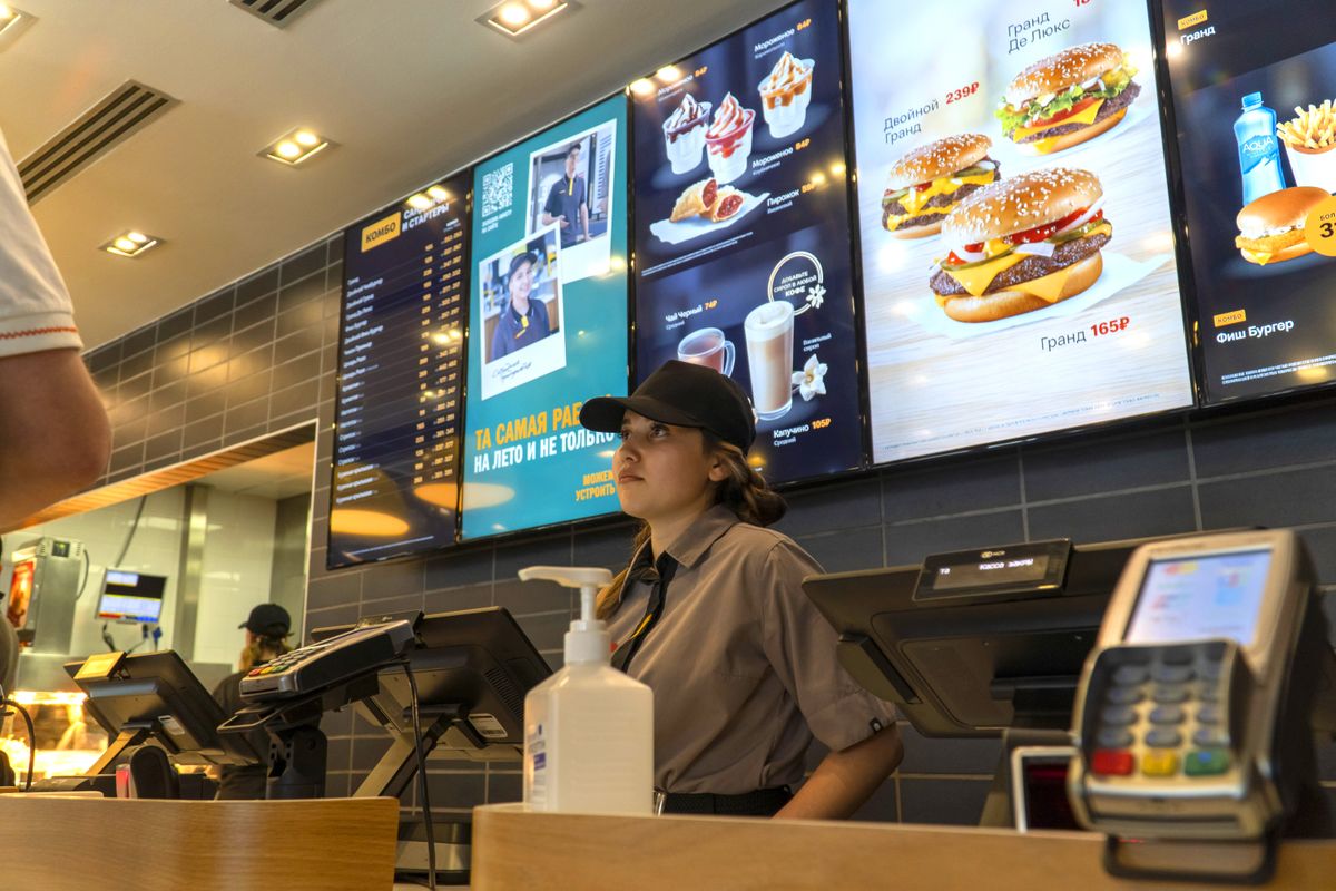 'Tasty, period': McDonald's in Russia reopens as Vkusno i Tochka MOSCOW, RUSSIA - JUNE 12: People visit former US fast food-chain McDonald's restaurant during its reopening under a new name Vkusno i Tochka, which translates as "Tasty, period in Moscow, Russia on June 12, 2022. The burger giant had suspended operations of all its 850 restaurants in Russia over the war in Ukraine in March, and announced a full exit in May. The chain was sold to businessman Oleg Govor, a local licensee since 2015, who now plans to reopen all its restaurants by the end of summer and expand the new brand to 1,000 locations across the country within two years. (Photo by Evgenii Bugubaev/Anadolu Agency via Getty Images)