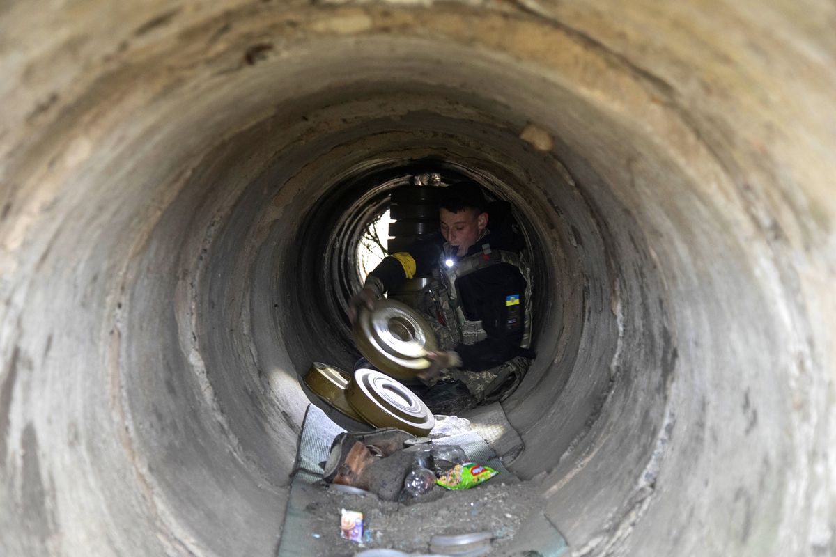 De-mining battalion continue its efforts to find and eliminate mines in Mykolaiv Oblast SNIHURIVKA, MYKOLAIV OBLAST, UKRAINE, NOVEMBER 12: A Ukrainian serviceman belonging to the de-mining battalion works disabling Russian mines inside a ditch on a field nearby to Snihurivka City in Mykolaiv Oblast, Ukraine, November 12th, 2022. (Photo by Narciso Contreras/Anadolu Agency via Getty Images)