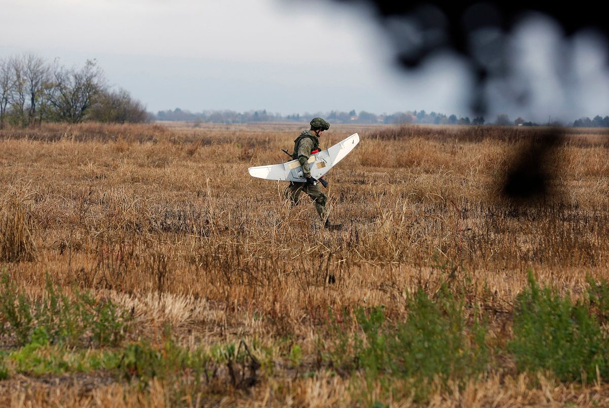 A Russian soldier carry a drone during the joint Russian, Belarusian and Serbian military exercise