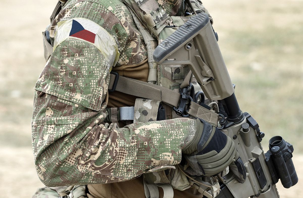 Soldier,With,Assault,Rifle,And,Flag,Of,Czech,Republic,On Soldier with assault rifle and flag of Czech Republic on military uniform. Collage. 