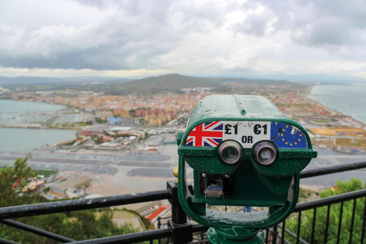 View from Rock of Gibraltar towards Spain with storm clouds and a telescope showing UK and the EU, Gibraltar