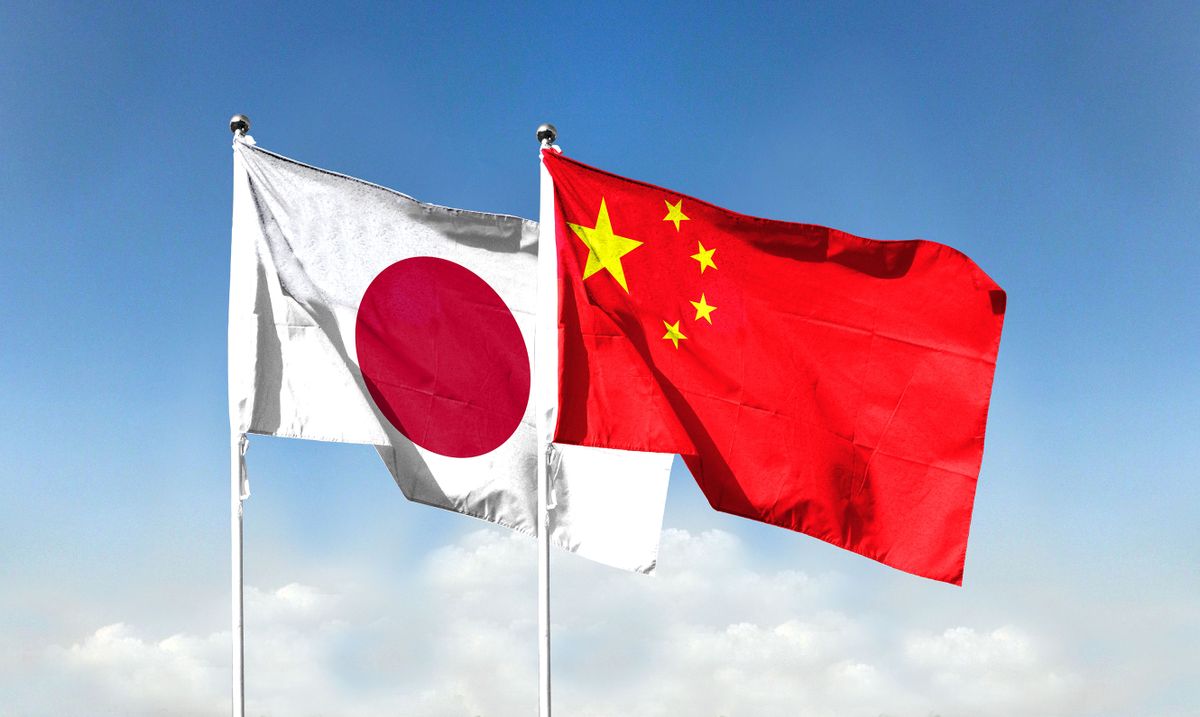 Chinese,Flag,And,Japanese,Flag,With,Blue,Sky.,Waving,Blue