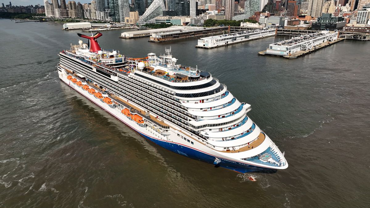 NEW YORK, US - JULY 15: An aerial view of cruise ship "Carnival Magic" sailing up the Hudson River in front of the skyline of Manhattan, New York City on July 15, 2022. The ship normally sails from Port Canaveral (Orlando), Miami, Norfolk, New York, and sails to Bahamas, Bermuda, Canada/New England, Caribbean for holidays between 2-9 days. A Carnival cruise features day and nighttime entertainment like stage shows, musical performances, deck parties, casinos and more. Lokman Vural Elibol / Anadolu Agency 