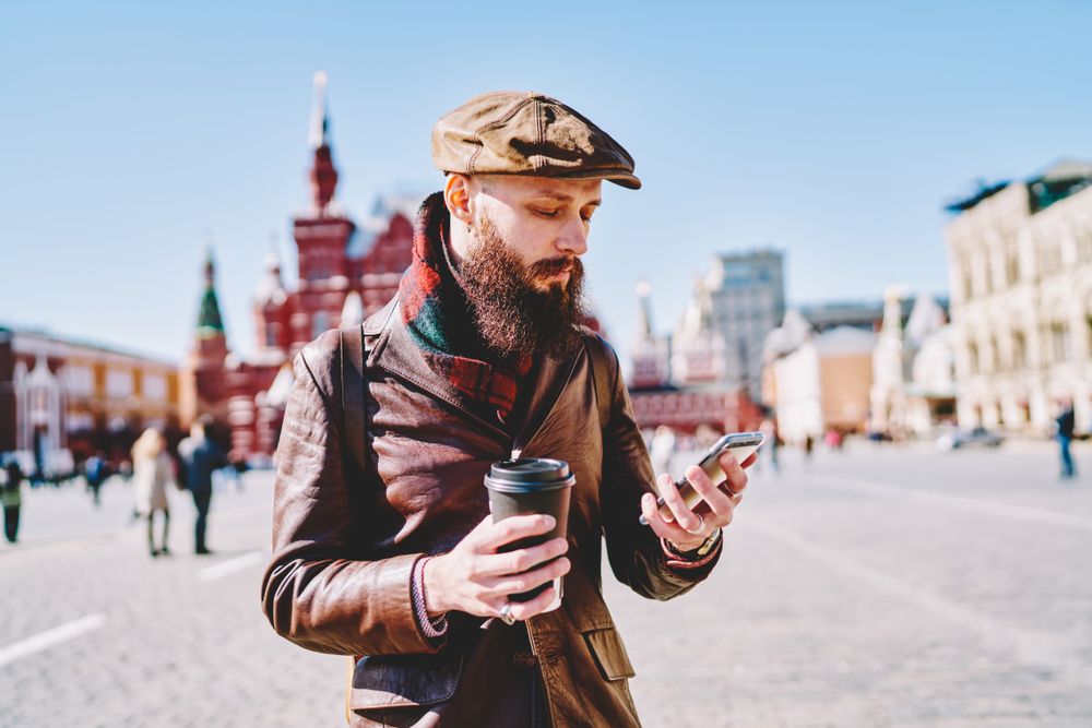 Bearded,Male,Tourist,Tracking,Gps,On,Smartphone,Device,Using,Wireless