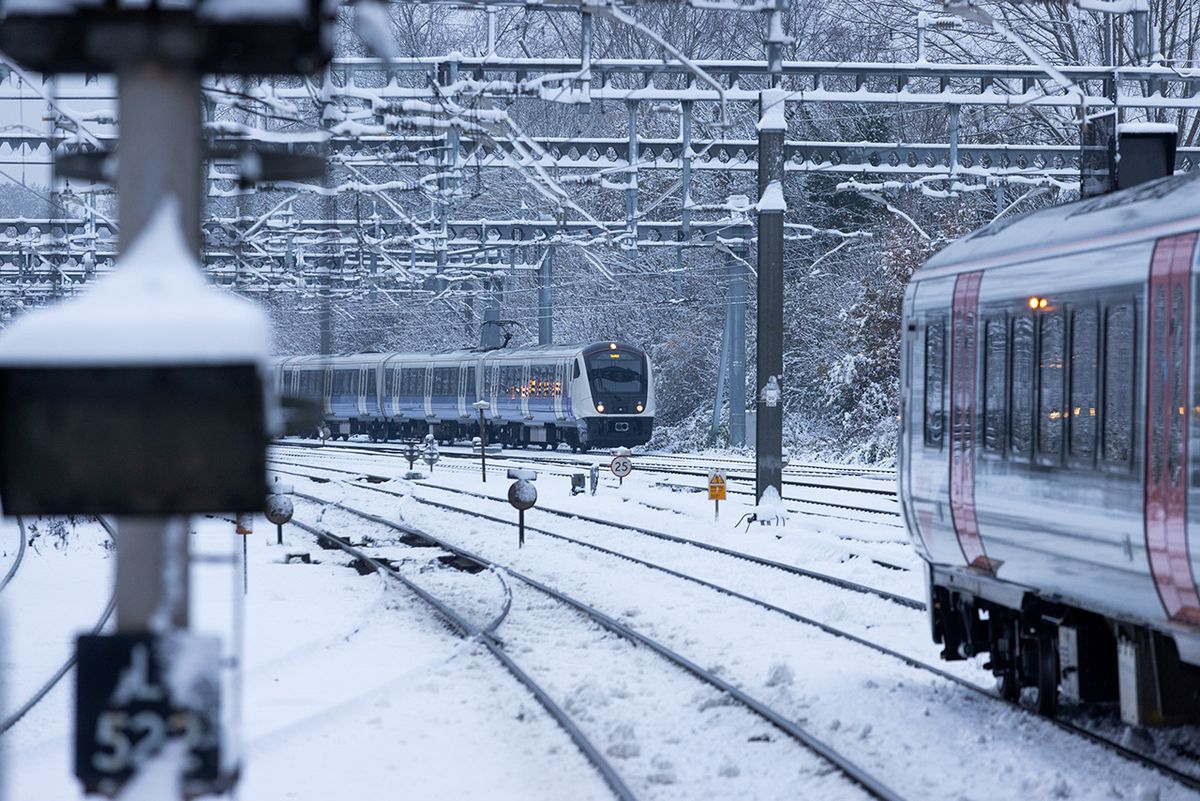 Blanket Of Snow And Ice Causes Travel Disruption Around Lond on An Elizabeth line passenger train arrives on snow covered railway tracks at Shenfield railway station in Shenfield, UK, on Monday, Dec. 12, 2022. With London blanketed in snow, the Met Office has yellow weather warnings for snow and ice in place throughout the UK until Thursday. Photographer: Chris Ratcliffe/Bloomberg via Getty Images