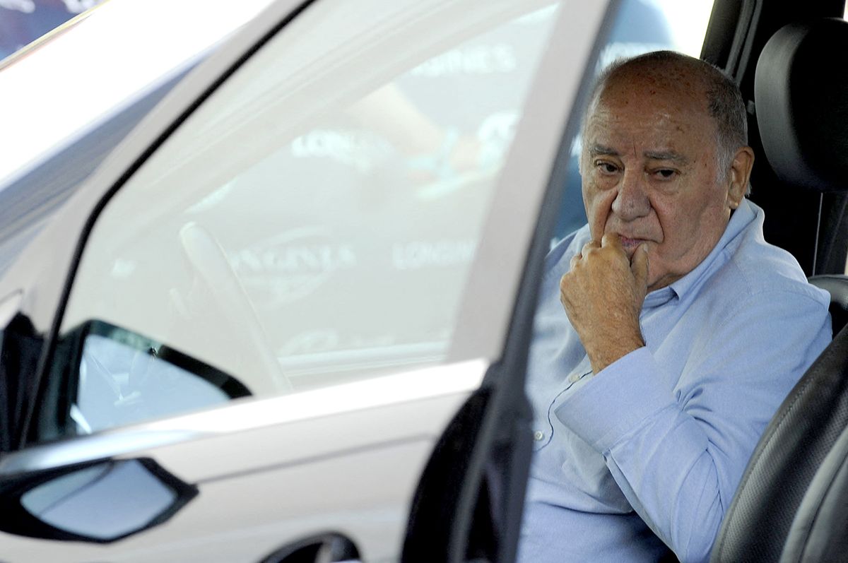 Founder and chairman of the Inditex fashion group Amancio Ortega sits in a car at the end of the 32nd edition of the A Coruna International Show Jumping competition at the Casas Novas Equestrian Centre in Arteixo, on July 31, 2016. (Photo by MIGUEL RIOPA / AFP)