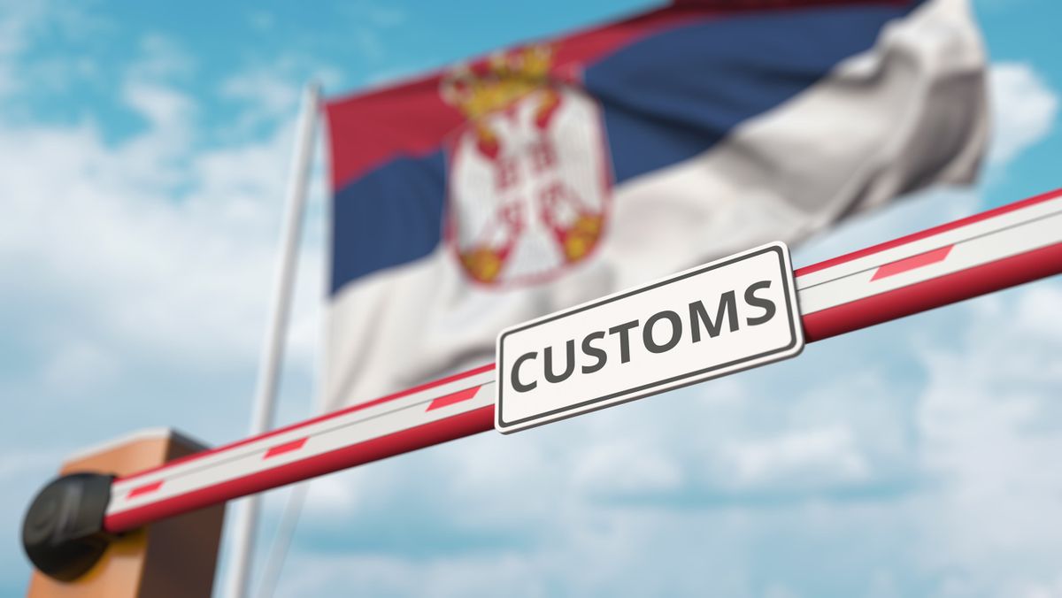 Closing,Boom,Barrier,With,Customs,Sign,Against,The,Serbian,Flag.