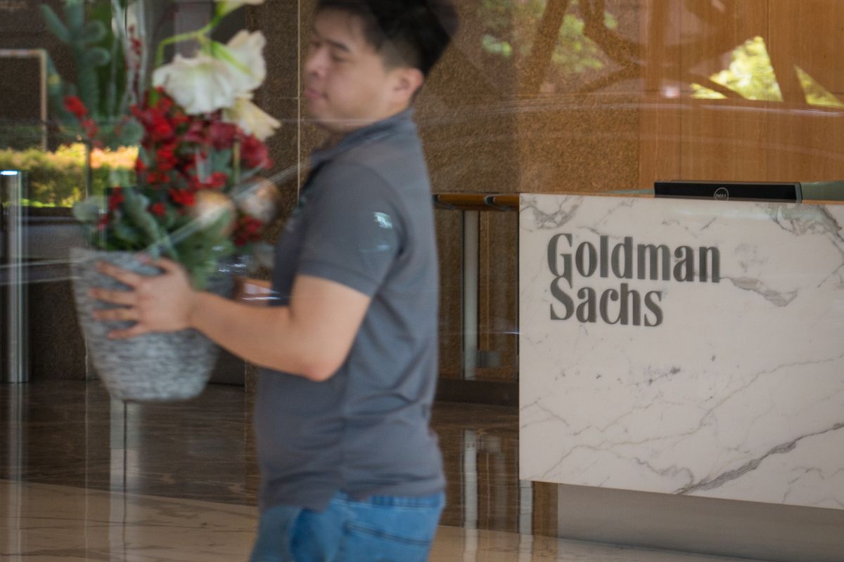 The Goldman Sachs Group Inc. logo is displayed in the reception area of the One Raffles Link building, which houses one of the Goldman Sachs (Singapore) Pte offices, in Singapore, on Saturday, Dec. 22, 2018. Singapore has expanded a criminal probe into fund flows linked to scandal-plagued 1MDB to include Goldman Sachs Group, which helped raise money for the entity, people with knowledge of the matter said. Photographer: /Bloomberg via Getty Images