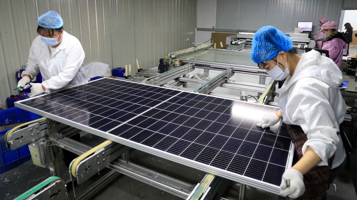 HEFEI, CHINA - FEBRUARY 18: Employees work on the production line of solar panel at a factory of Anhui Daheng Energy Technology Co., Ltd on February 18, 2021 in Hefei, Anhui Province of China. (Photo by )