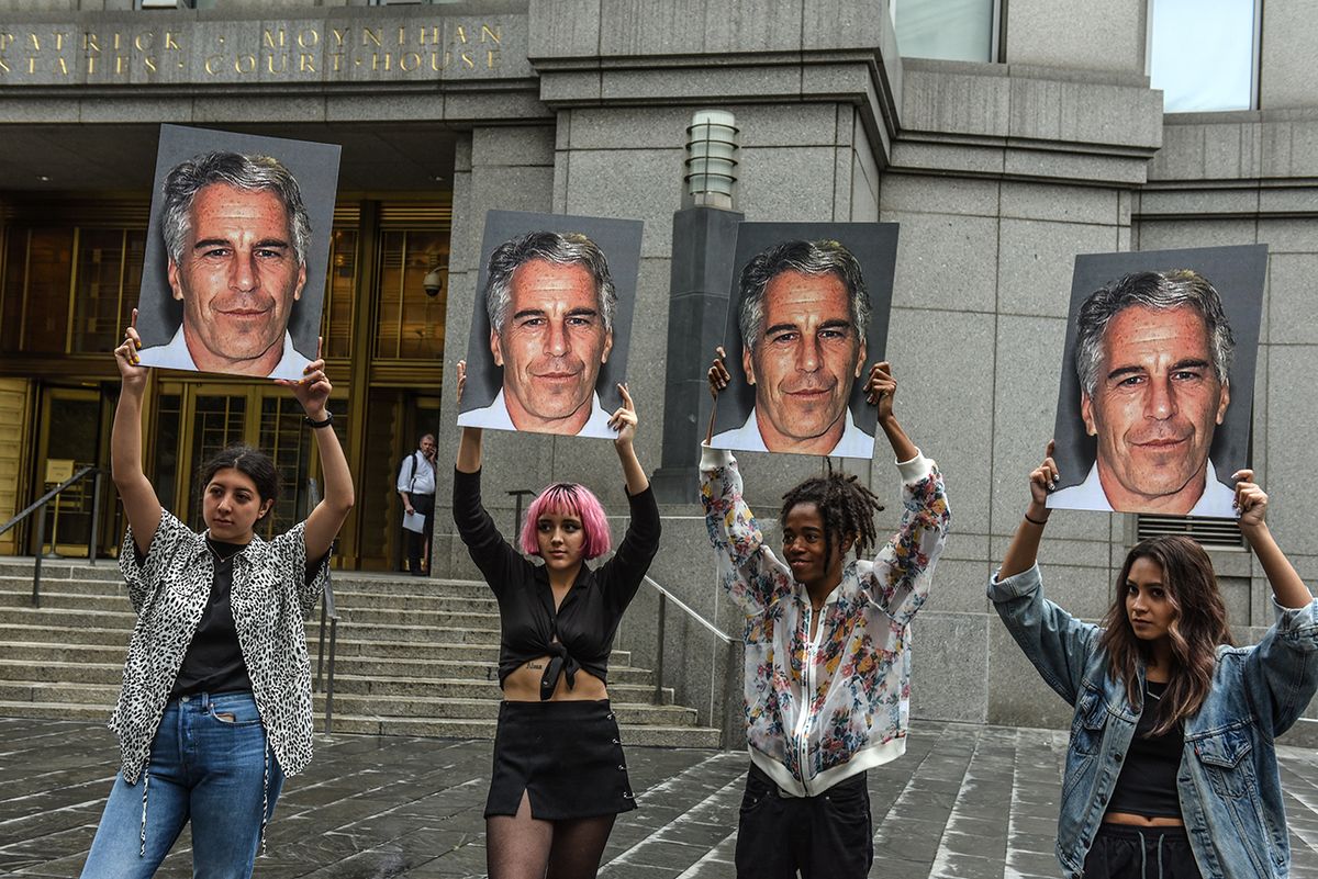 Jeffrey Epstein Appears In Manhattan Federal Court On Sex Trafficking Charges NEW YORK, NY - JULY 08: A protest group called "Hot Mess" hold up signs of Jeffrey Epstein in front of the Federal courthouse on July 8, 2019 in New York City. According to reports, Epstein will be charged with one count of sex trafficking of minors and one count of conspiracy to engage in sex trafficking of minors. (Photo by Stephanie Keith/Getty Images)