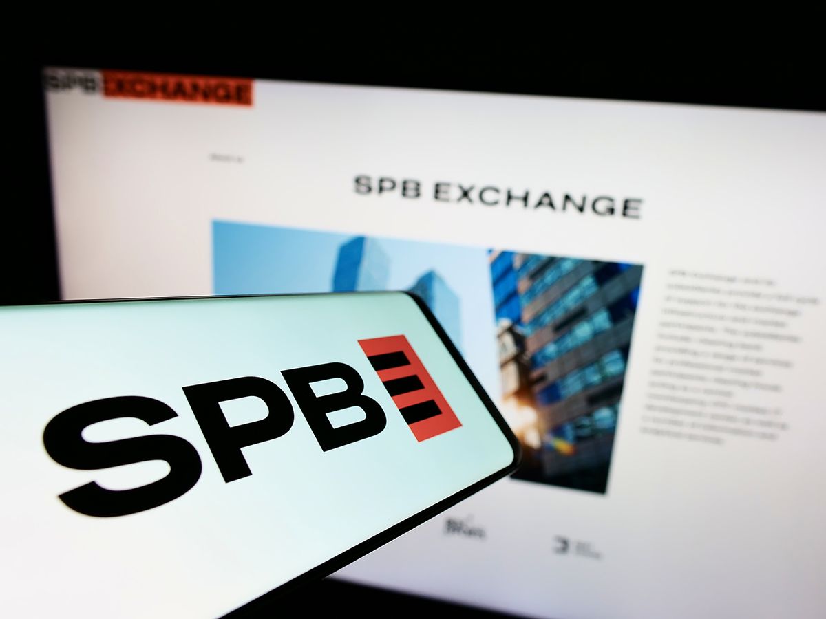 Stuttgart,,Germany,-,06-18-2022:,Mobile,Phone,With,Logo,Of,Russian Stuttgart, Germany - 06-18-2022: Mobile phone with logo of Russian financial marketplace SPB Exchange on screen in front of business website. Focus on center of phone display. Unmodified photo.