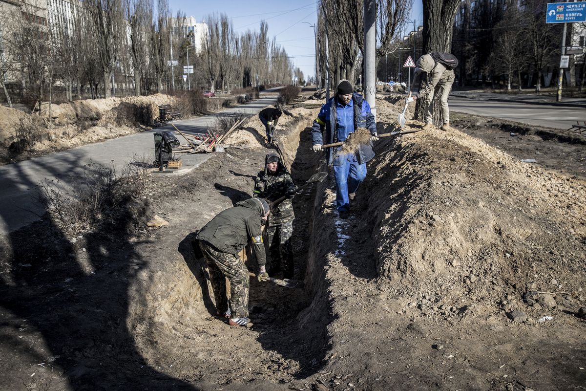 KYIV, UKRAINE - MARCH 10: Trenches are prepared by the side of the road as a precaution amid Russian attacks, in Kyiv, Ukraine on March 10, 2022. Emin Sansar / Anadolu Agency (Photo by Emin Sansar / ANADOLU AGENCY / Anadolu Agency via AFP)