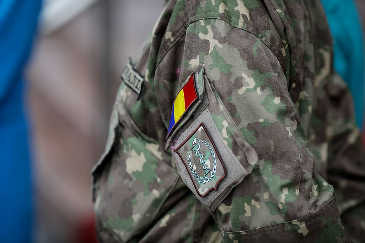 Bucharest,,Romania,-,January,05,,2021:,Shallow,Depth,Of,Field Bucharest, Romania - January 05, 2021:  Shallow depth of field (selective focus) image with the uniform and insignia of a Romanian army medic.