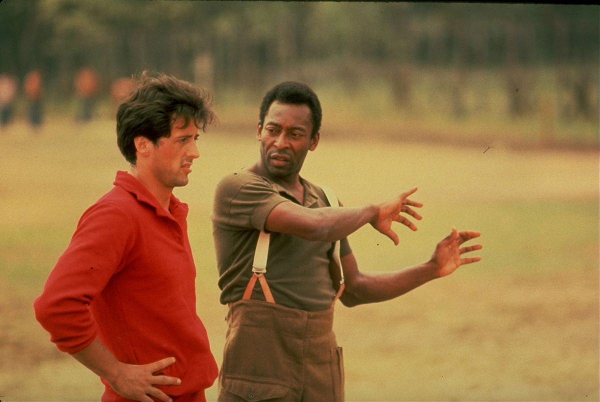 Sylvester Stallone Gets Advice From Pele, (L-R) Actor Sylvester Stallone getting pointers fr. soccer great Pele during filming of motion picture Escape to Victory.    (Photo by John Bryson/Getty Images)