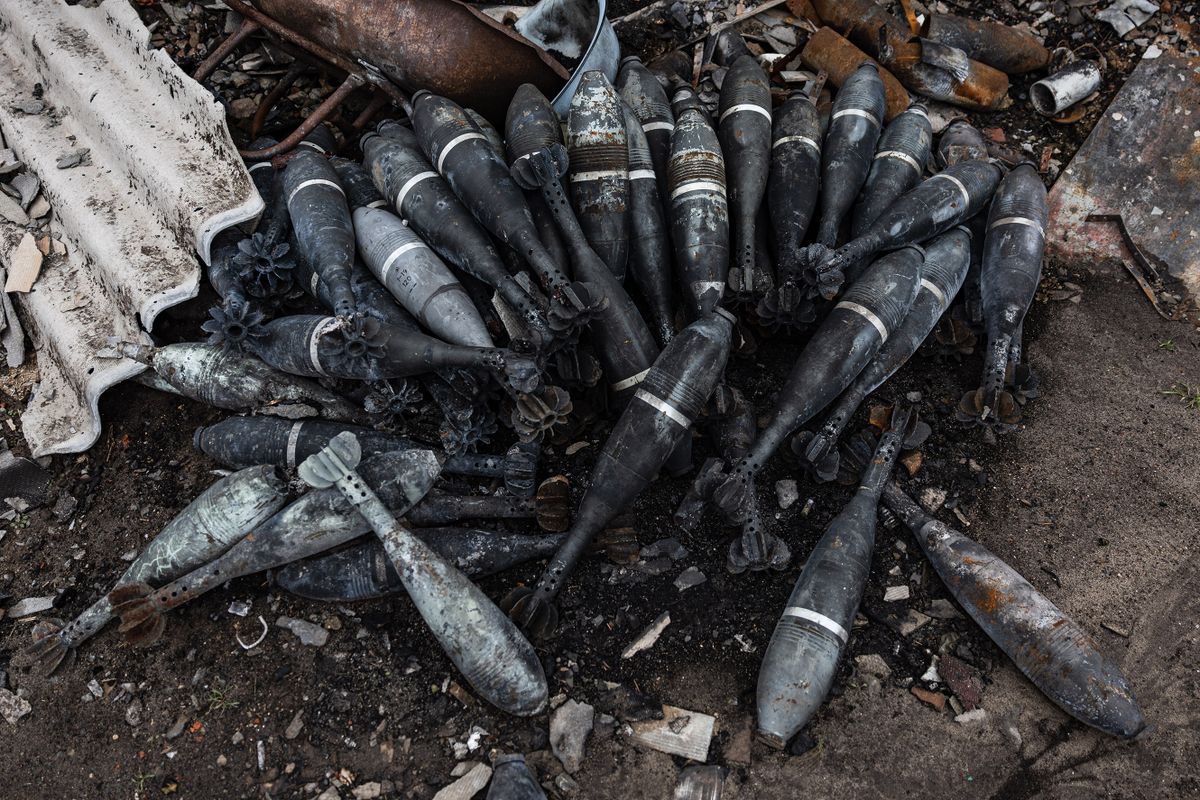 This photograph taken on December 26, 2022 shows unexploded mortar ammunitions displayed on the ground in Kam'yanka, eastern Ukraine. 