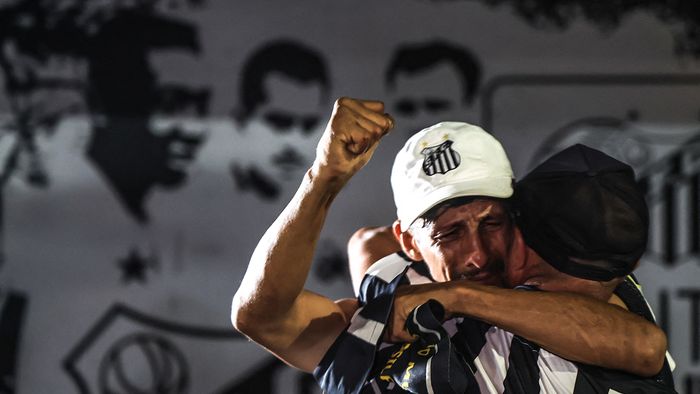 SANTOS, MOVEMENT VILA BELMIRO SP - Santos - 12/24/2022 - SANTOS, VILA BELMIRO MOVEMENT. Fans and supporters hold a vigil at the Vila Belmiro stadium for former soccer player Pele. Pele is considered the greatest football player in all history, after a period of hospitalization for treatment of colon cancer, he did not resist the complications of the disease and died this Thursday (29), at the age of 82. Pele played for Santos for almost 20 years and won three World Cups. Photo: Marcello Zambrana/AGIF (Photo by Marcello Zambrana / AGIF / AGIF via AFP)
