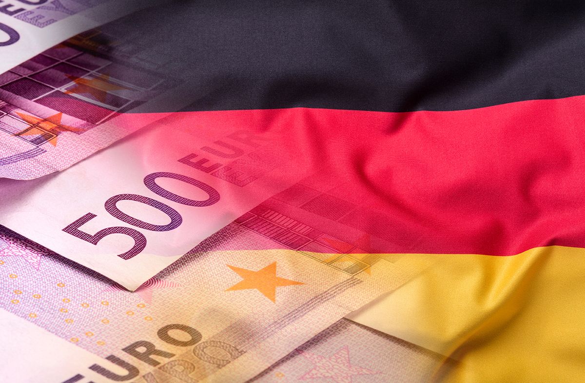 Flags,Of,The,Germany,With,Euro,Banknotes. Flags of the Germany with euro banknotes.