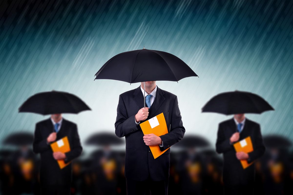 Team,Of,Business,Insurers.,Businessmen,With,Umbrella,Standing,In,Stormy