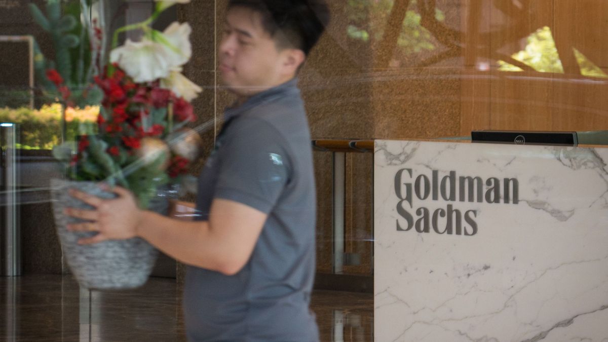 The Goldman Sachs Group Inc. logo is displayed in the reception area of the One Raffles Link building, which houses one of the Goldman Sachs (Singapore) Pte offices, in Singapore, on Saturday, Dec. 22, 2018. Singapore has expanded a criminal probe into fund flows linked to scandal-plagued 1MDB to include Goldman Sachs Group, which helped raise money for the entity, people with knowledge of the matter said. Photographer: /Bloomberg via Getty Images