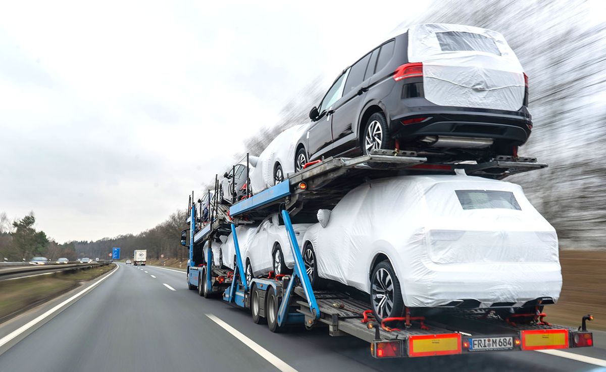 New cars from Volkswagen, 13 February 2019, Lower Saxony, Burgdorf: A car transporter with new Volkswagen cars of the Tiguan and Touran models travels along the B3 federal highway (slow shutter). Following a strong 2018, Volkswagen's core brand VW Passenger Cars delivered significantly fewer cars in January. Worldwide, 515,500 vehicles were delivered to customers in that month - 3.4 percent less than in the same month last year, as the company announced on February 13, 2019. Photo: Raphael Knipping/dpa (Photo by Raphael Knipping/picture alliance via Getty Images)