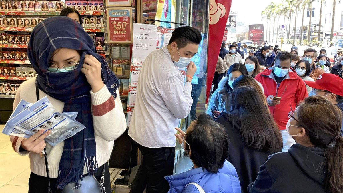 Local people wearing mask form a long line to purchase a mask at a drug store in Hong Kong, China on January 31, 2020, amid a growing concern to spread a new type of coronavirus through a person to person transmission. The number of the patients who have been infected with a new coronavirus has reached to over 17,200 and the death toll has been confirmed 361 so far as of February 3rd in China. As the outbreak continues to spread outside China, the World Health Organization (WHO) declared the new coronavirus a Global Health Emergency on Jan 31st.