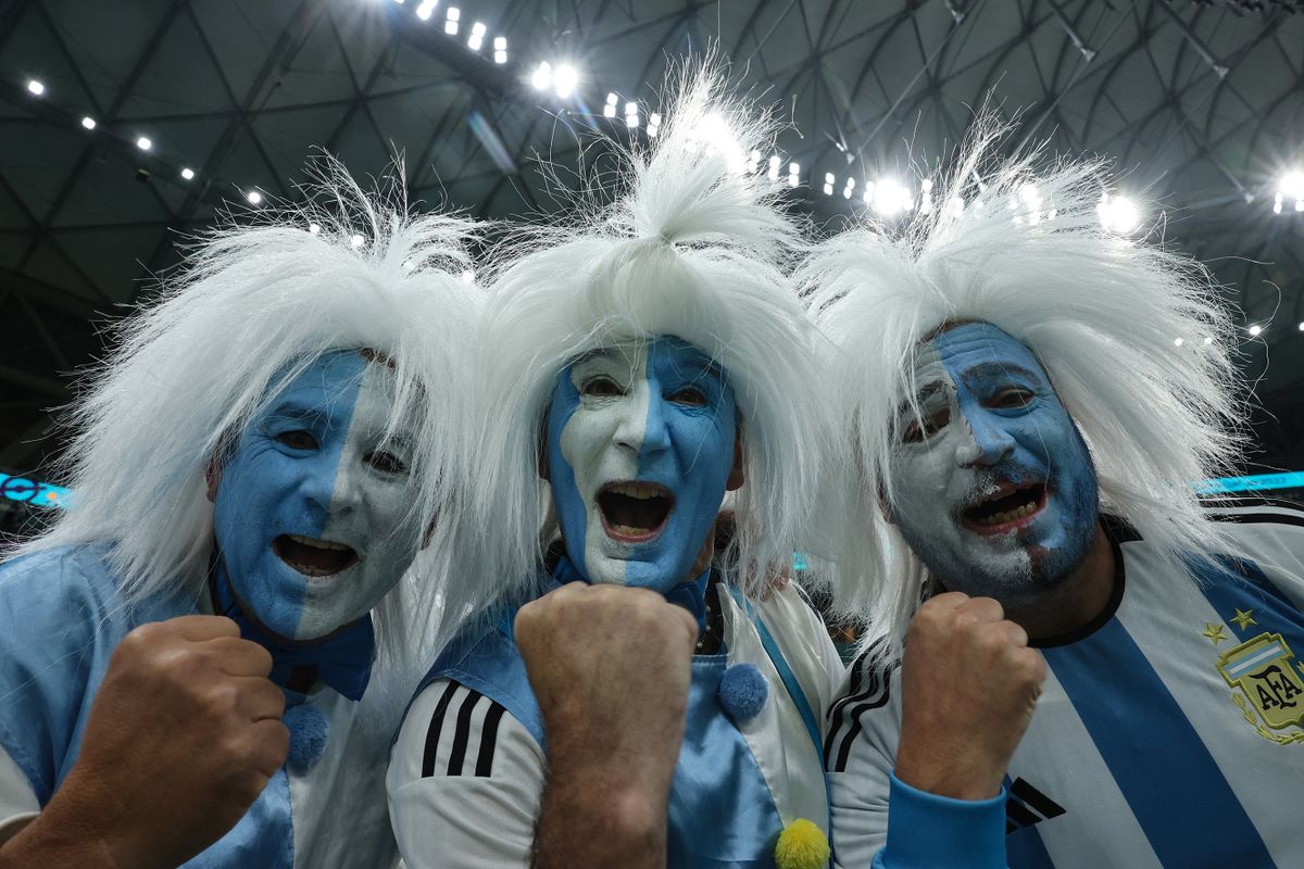 Argentina supporters cheer before the start of the Qatar 2022 World Cup football semi-final match between Argentina and Croatia at Lusail Stadium in Lusail, north of Doha on December 13, 2022. 