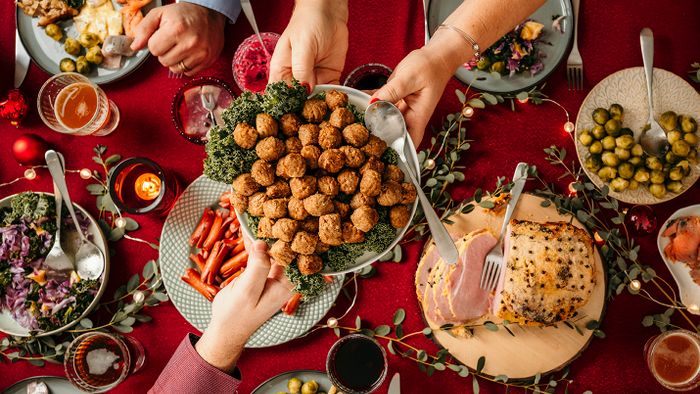 Christmas Food Smorgasbord Typical swedish scandinavian christmas smörgåsbord buffet food Photo taken from above overhead table top shot Photot of typical smorgasbord with breaded ham, meatballs, sausauge,noisette, pickled herring and side dishes Julbord med griljerad skinka sill och lax