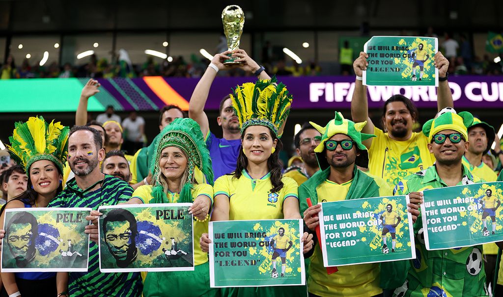 Croatia v Brazil: Quarter Final - FIFA World Cup Qatar 2022 AL RAYYAN, QATAR - DECEMBER 09: Brazil fans hold up posters in support of former Brazil player Pele prior to the FIFA World Cup Qatar 2022 quarter final match between Croatia and Brazil at Education City Stadium on December 09, 2022 in Al Rayyan, Qatar. (Photo by Michael Steele/Getty Images)