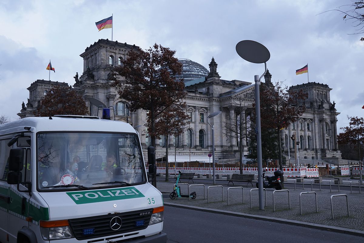 Police Conduct Nationwide Raids Against Insurrectionist Group BERLIN, GERMANY - DECEMBER 07: A police van stands outside the Reichstag, seat of the Bundestag, Germany's parliament, on the day police conducted nationwide raids against a suspected insurrectionist group on December 07, 2022 in Berlin, Germany. Law enforcement agencies conducted raids nationwide today and arrested 25 people whom they claim are in an organization bent on violently overthrowing the German government. According to Germany's prosecutor general, the group is driven by a mix of conspiracy theories and far-right ideology, including influence of the Q-Anon and Reichsbürger movements. Among its members are former members of an elite military unit and former police. The leader of the group is reportedly a German aristocrat named Heinrich Reuss, also known as Prince Heinrich XIII, who was to lead the new government following an insurrection. (Photo by Sean Gallup/Getty Images)