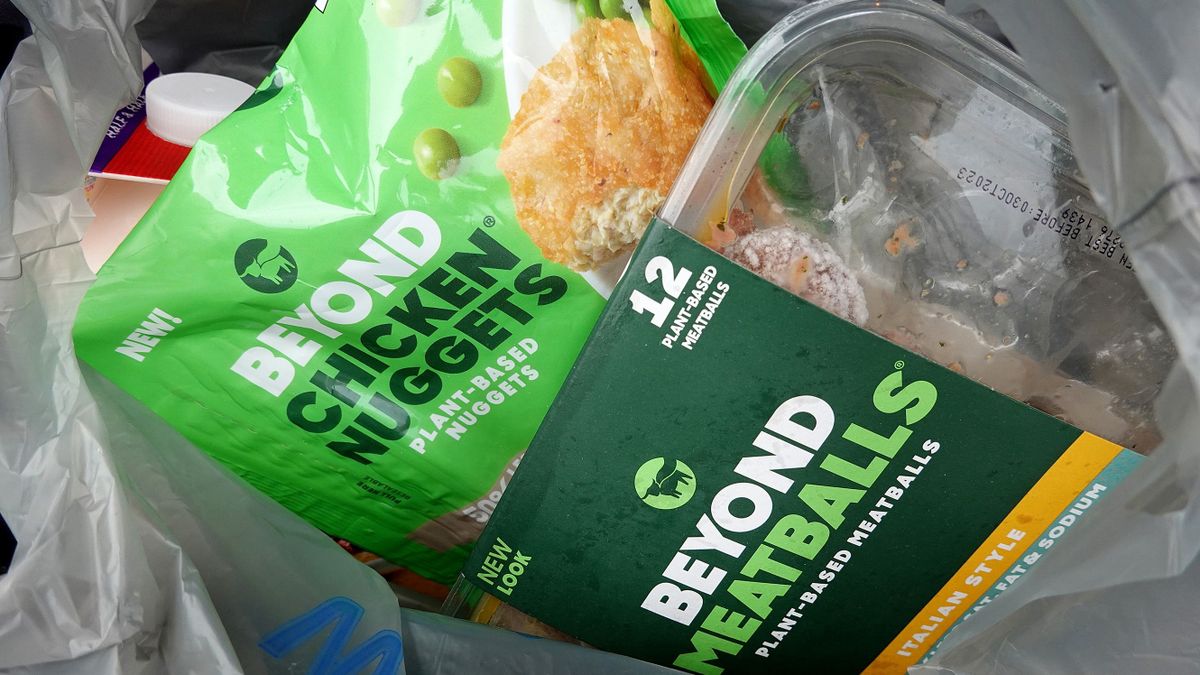 MIAMI, FLORIDA - NOVEMBER 21: In this photo illustration,  a Beyond Meat meatball as well as a chicken nuggets product in a grocery bag on November 21, 2022 in Miami, Florida. Beyond Meats stock has slumped nearly 83 percent in the past year as the company is losing money and amassing debt. 
