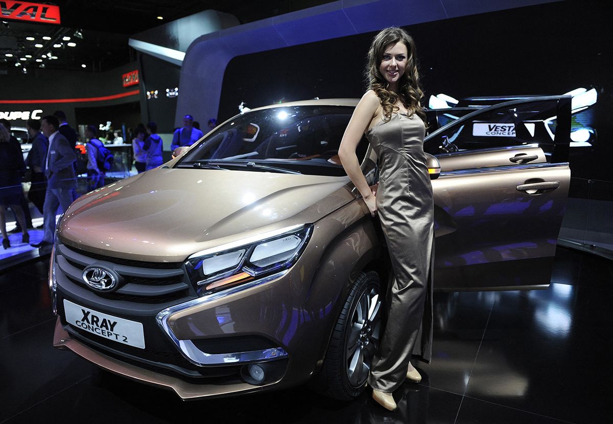 MOSCOW, RUSSIA - SEPTEMBER 05: A model poses next to Lada Xray Concept 2 exhibited during the Moscow International Motor Show 'Autosalon 2014' the leading automotive event of the year in Moscow, September 5, 2014. Moscow International Automobile Salon becomes the main platform of the country from which to demonstrate the latest novelties of national and global automotive industries. Sefa Karacan / Anadolu Agency (Photo by SEFA KARACAN / ANADOLU AGENCY / Anadolu Agency via AFP)