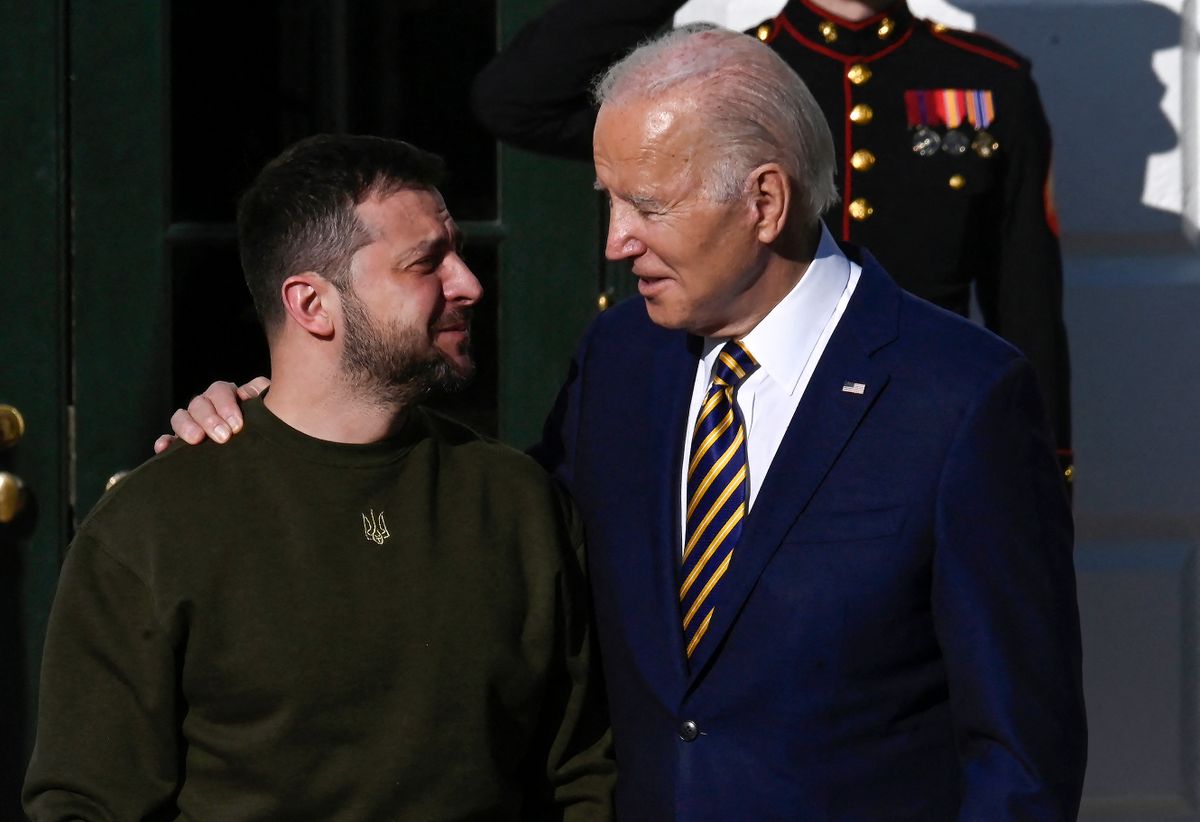 US President Joe Biden welcomes Ukraine's President Volodymyr Zelensky on the South Lawn of the White House in Washington, DC, on December 21, 2022. - Zelensky is in Washington to meet with US President Joe Biden and address Congress -- his first trip abroad since Russia invaded in February. 