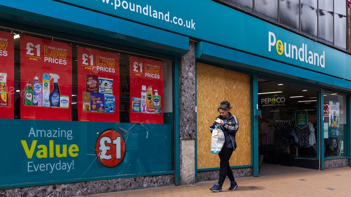 Members of the public pass by a neglected branch of Poundland, a chain of value shops where most items are on sale for only £1, as a report published by think tank the Resolution Foundation reveals the government's levelling-up agenda, an initiative to close the economic gap between the country's richest and poorest regions, will cost billions more than initially estimated on 29th June, 2022 in Barnsley, United Kingdom. Barnsley, a South Yorkshire town that has ranked one of the most deprived in England, has so far had both of its bids for funding rejected. 