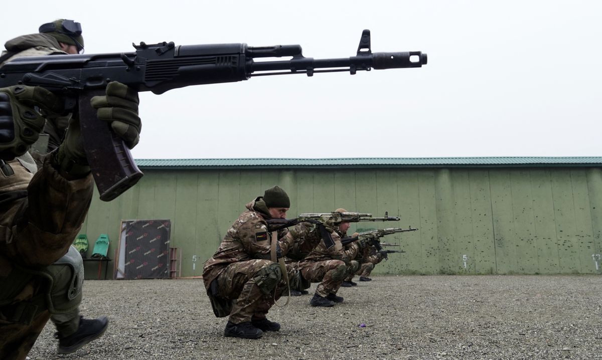 Volunteers and special force troopers are put through their paces during military training at a "Russian University of Special Forces" training centre in the town of Gudermes, in Chechnya, on December 14, 2022. (Photo by AFP)