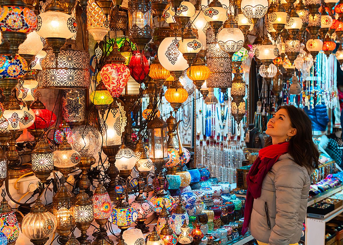 Smiling young woman looking at Turkish lamps for sale in the Grand Bazaar, Istanbul, Turkey
Smiling young woman looking at Turkish lamps for sale in the Grand Bazaar, Istanbul, Turkey
