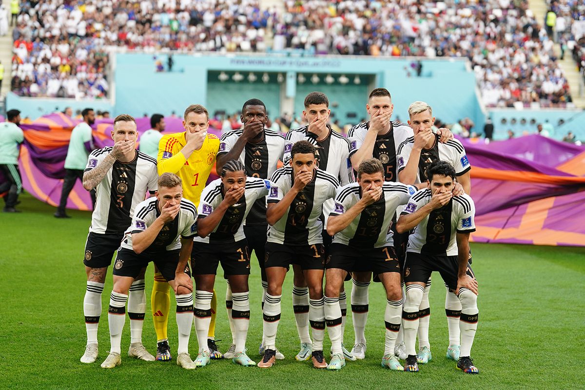 Germany v Japan - FIFA World Cup 2022 - Group E - Khalifa International Stadium German players cover their mouths as they pose for a team group ahead of the FIFA World Cup Group E match at the Khalifa International Stadium, Doha. Picture date: Wednesday November 23, 2022. (Photo by Mike Egerton/PA Images via Getty Images)