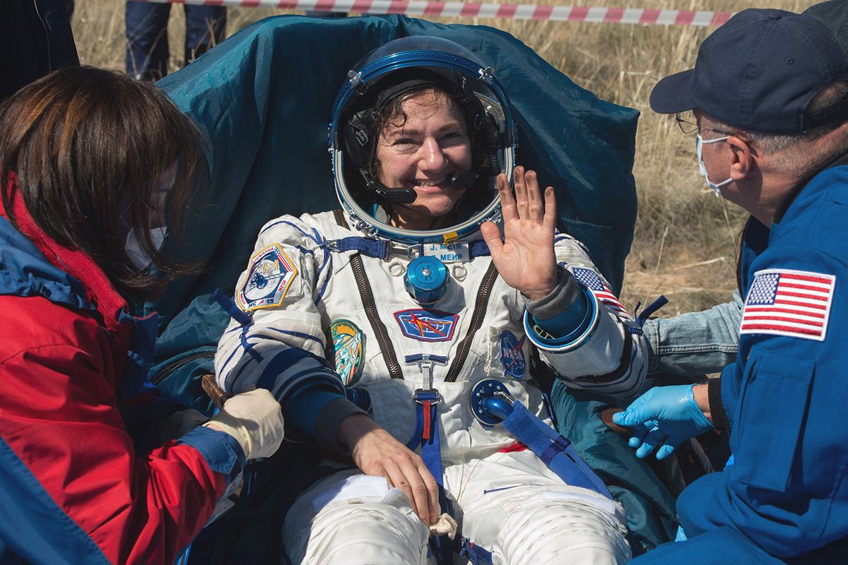 NASA astronaut Jessica Meir reacts shortly after landing in a remote area outside the town of Dzhezkazgan (Zhezkazgan), Kazakhstan, on April 17, 2020. - Two NASA astronauts and a Russian cosmonaut on April 17 made a safe return from the International Space Station to find the planet transformed by the coronavirus pandemic.  Andrew Morgan, Jessica Meir and Oleg Skripochka touched down in central Kazakhstan at 0516 GMT in the first returning mission since the World Health Organisation declared COVID-19 a global pandemic in March. (Photo by Andrey Shelepin/GCTC / Russian Space Agency Roscosmos / AFP) / RESTRICTED TO EDITORIAL USE - MANDATORY CREDIT "AFP PHOTO / Russian Space Agency Roscosmos / GCTC / Andrey Shelepin " - NO MARKETING - NO ADVERTISING CAMPAIGNS - DISTRIBUTED AS A SERVICE TO CLIENTS KAZAKHSTAN-RUSSIA-US-SPACE-ISS-LANDING